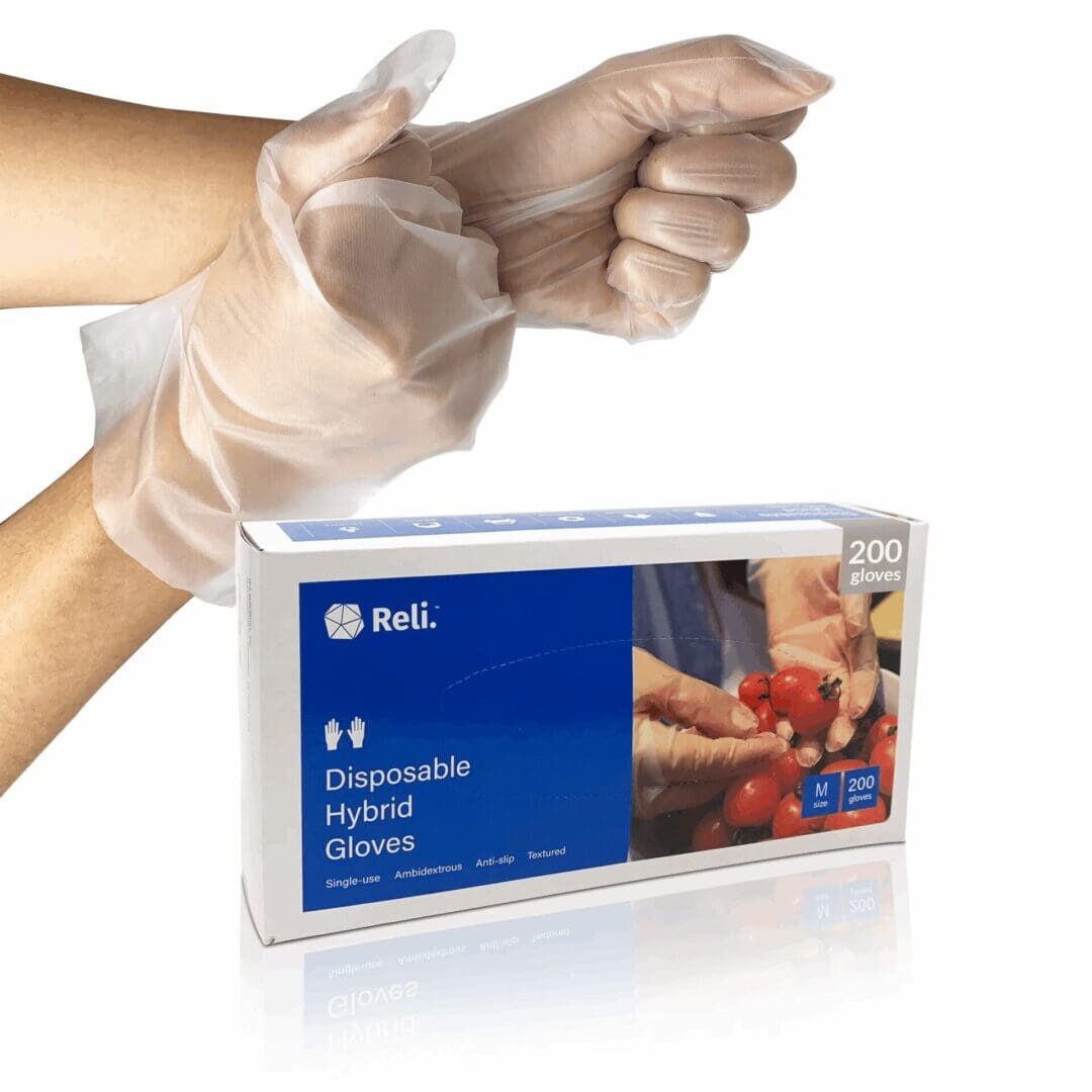 Hands wearing disposable hybrid gloves, box nearby.