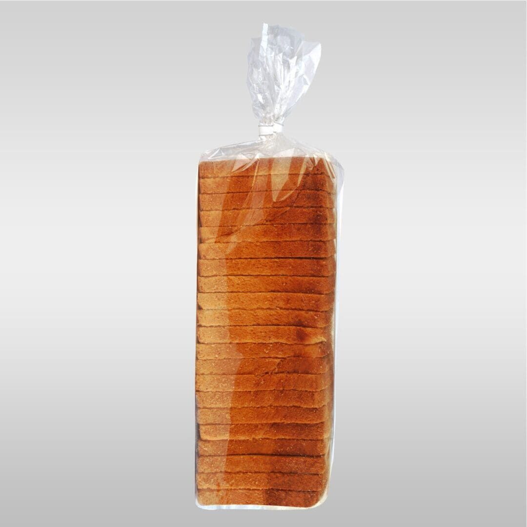 A loaf of bread is wrapped in plastic.