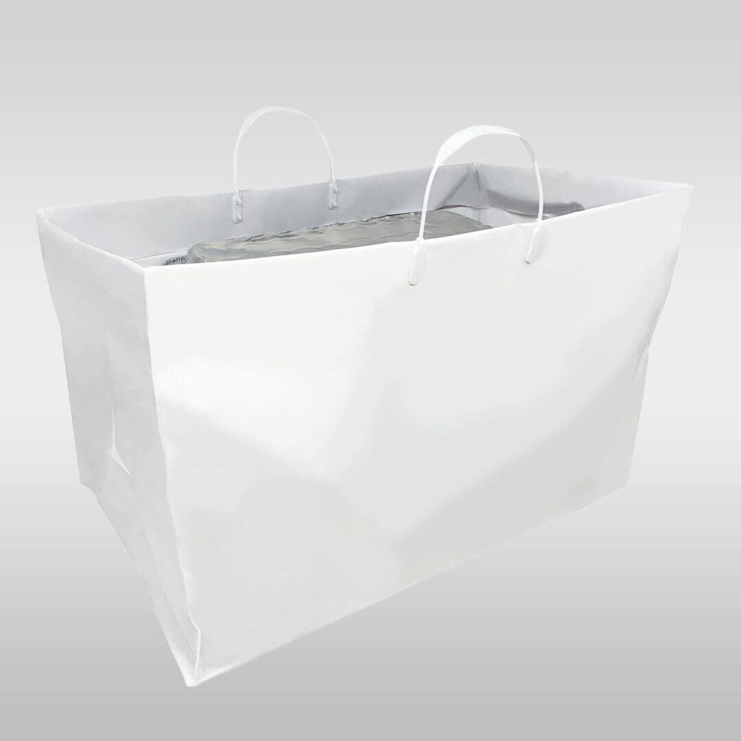 A white bag with handles and a silver foil liner.